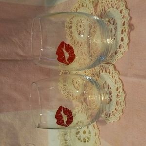 Lips kiss wine glasses